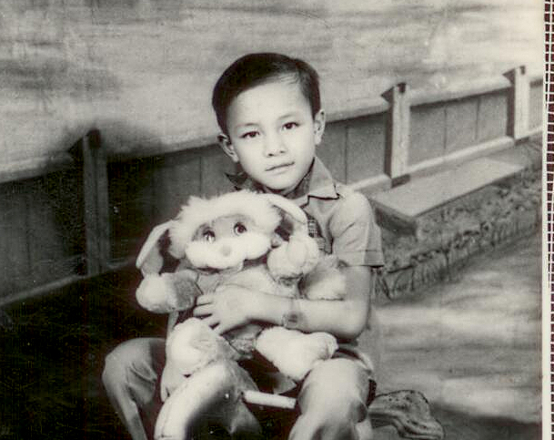 Hugo riding wooden horse at age 7