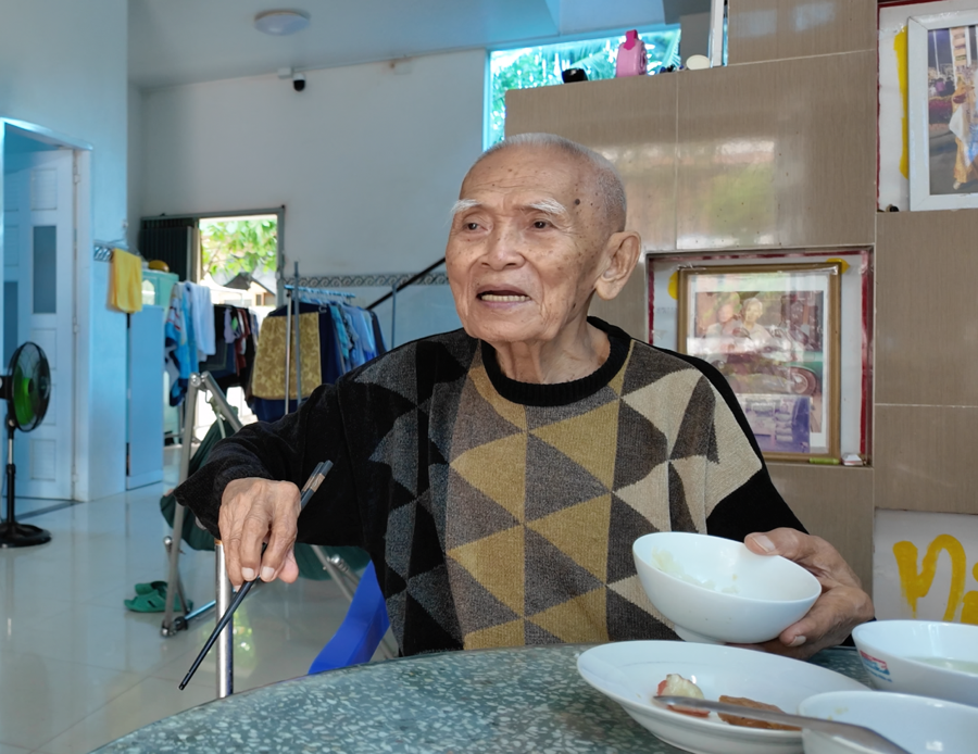 The maternal grandfather chatting with me while enjoying dinner