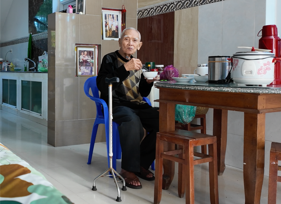 The maternal grandfather having dinner
