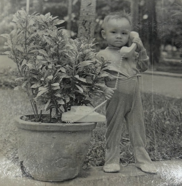 Posing for picture taken at age 3
