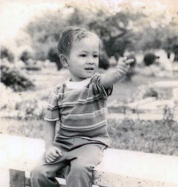 Pointing Finger while seating on a bench at Nha Trang beach