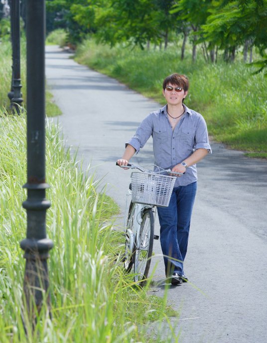Walking With Bike In A Park